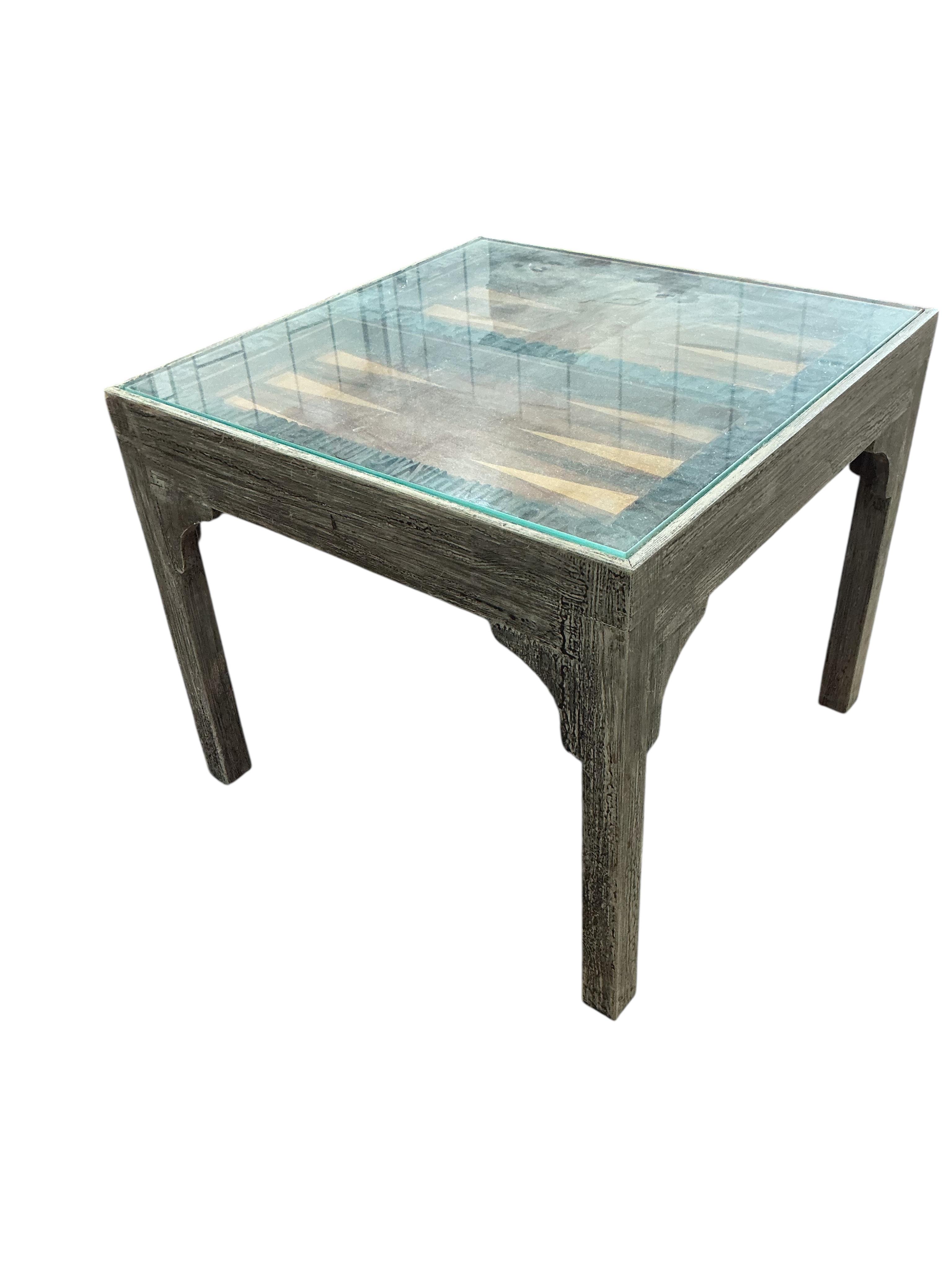 A pair of grey painted printing block inset lamp tables, one with backgammon board, width 47cm, depth 47cm, height 42cm